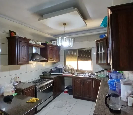 A distinctive ground floor apartment for sale, with luxurious finishes, 205 square meters, and outdoor terraces, in the most beautiful locations in Shafa Badran El Kom.