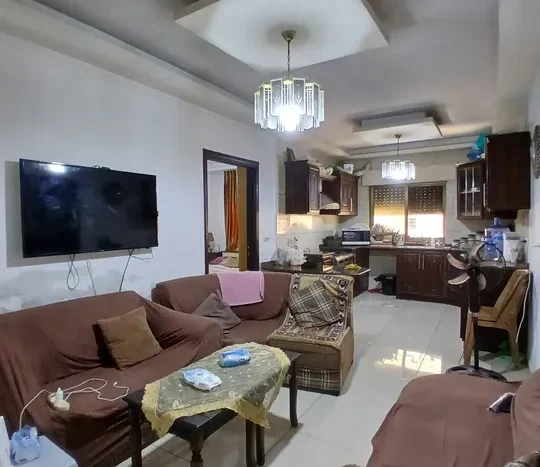 A distinctive ground floor apartment for sale, with luxurious finishes, 205 square meters, and outdoor terraces, in the most beautiful locations in Shafa Badran El Kom.