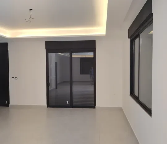 For sale a new villa in a prime location in Al-Fuhais, Al-Hamra Basin, 570 square meters, with a luxurious, modern design